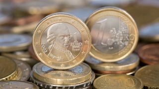 Österreichische Ein-Euro-Münze mit einer Abbildung des Komponisten Wolfgang Amadeus Mozart.
