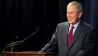 Former US President George W. Bush reacts as he speaks during the Civil Rights Summit at the LBJ Presidential Library